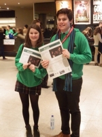 Tom and Ffion seeling the MUNity nemspaper.jpg