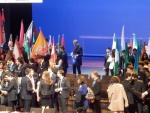 Oleg furling the flag after closing ceremony.JPG